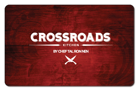 Crossroads Kitchen logo in white on a red wooden background with artistic watermarks.
